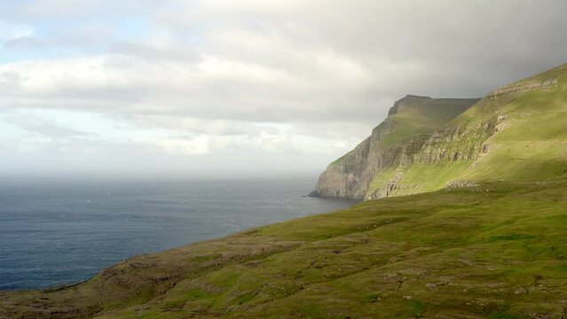 aerial panorama of faroe islands on sunset during a cloudy day