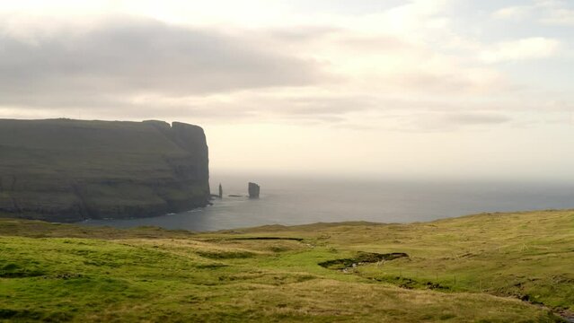 aerial view of faroe islands on sunset during a cloudy day