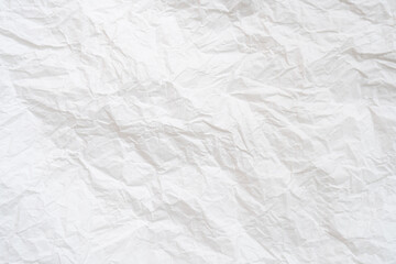 Wrinkled or crumpled white stencil or tissue paper used for crumpled paper background texture.