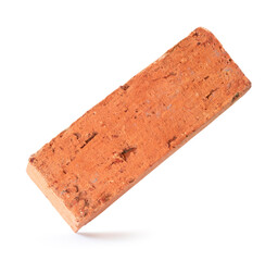 Single cracked old red or orange brick isolated on white background with clipping path