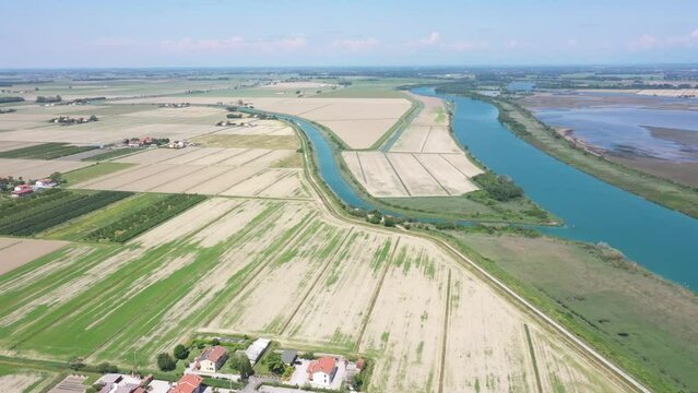 beautiful drone view of a river and some roads in the grado's laggon