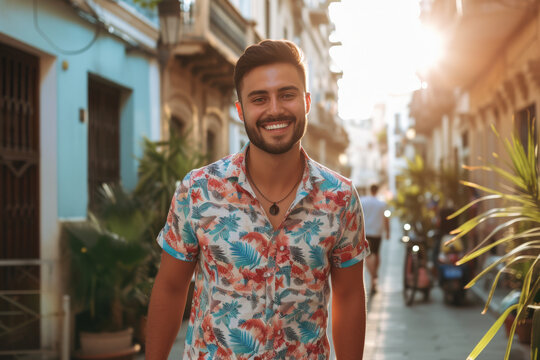 A man wearing a floral shirt is smiling for the camera