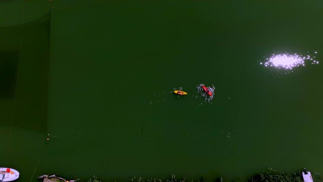 drone view of a couple of canoeists in the lagoon