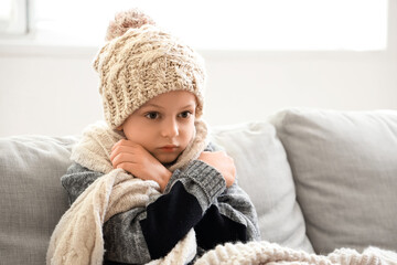 Ill little boy having fever at home, closeup