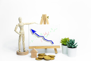 Mannequin drawing a graph charts on easel; isolated on white background; Business or finance concept