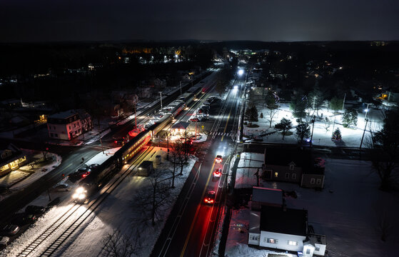 Aerial view of the Shirley, Massachusetts train station at night during winter 