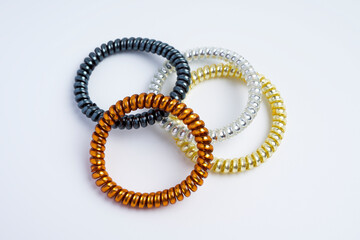 Four spring hairbands in different colors used for tying hair