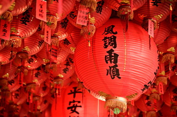 Naklejka premium Taipei, Taiwan - Feb 01, 2024: The worship lanterns in the temple to pray for blessing. The lantern in the picture says 