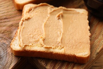 Tasty peanut butter sandwich on table, closeup view