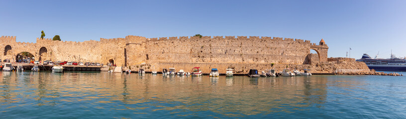 Fishing boats under the fortress wall on the island of Rhodes.