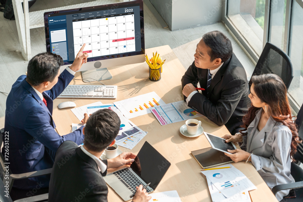 Poster calendar on computer software application for modish schedule planning for personal organizer and on