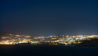Mykonos village illuminated at dusk on Mykonos island. Greece