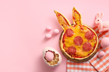 Composition with tasty pizza and Easter eggs on pink background