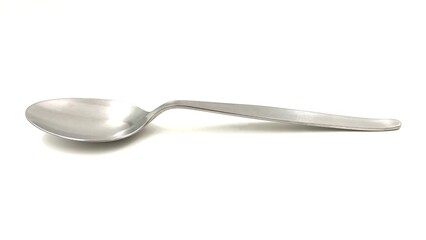 Photo of a silver spoon, isolated on white background.