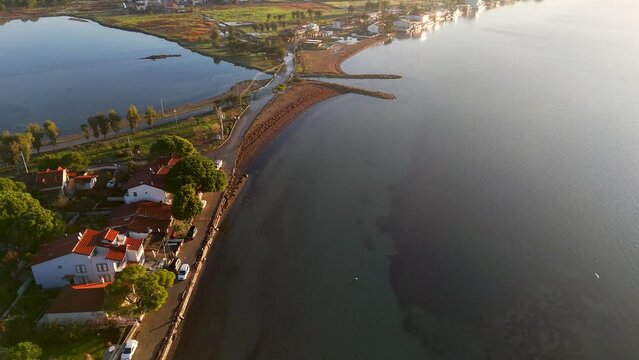 seaside town on a gulf at sunset time and colors aerial photos