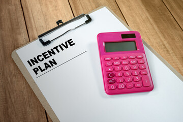 Calculator and notes with incentive plan text