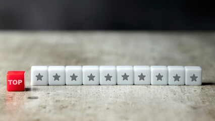 A row of small cubes with the top text and star symbol
