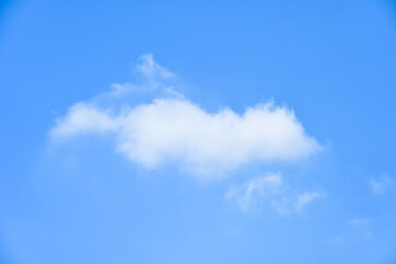 beautiful blue sky and white fluffy single cloud with sunrise in the morning, natural background