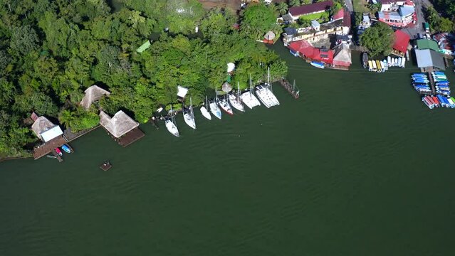 Buildings and boats closely together as land meets water. Aerial