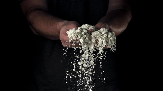 Flour in the hands of a cook. Filmed on a high-speed camera at 1000 fps. High quality FullHD footage