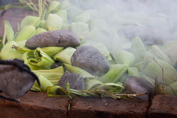 Photograph of preparation of the traditional Pachamanca in Peru. Typical dish from the Andes of Peru.