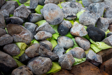 Photograph of preparation of the traditional Pachamanca in Peru. Typical dish from the Andes of Peru.