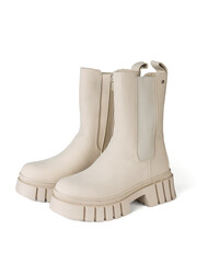 A pair of fashionable light insulated boots insulated on a white background.