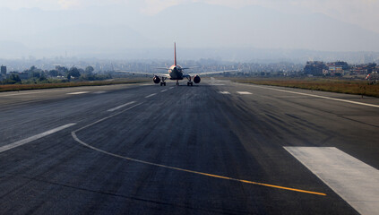 airline is ready to fly on the runway with cityscape background in kathmandu