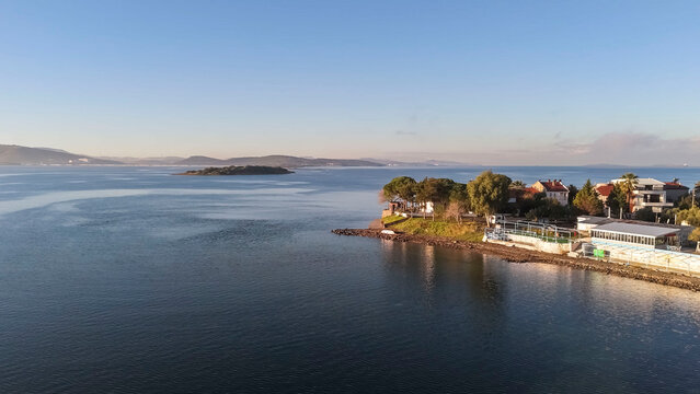 seaside town on a gulf at sunset time and colors aerial photos