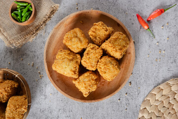 Tahu goreng cripsy, or crispy fried tofu, is one type of snack in Indonesia. Crispy tofu is mixed with small chilies and sauce