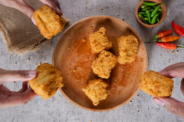 Tahu goreng cripsy, or crispy fried tofu, is one type of snack in Indonesia. Crispy tofu is mixed with small chilies and sauce