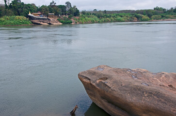 The narrowest section of the Mekong River separates the border between Thailand and Laos