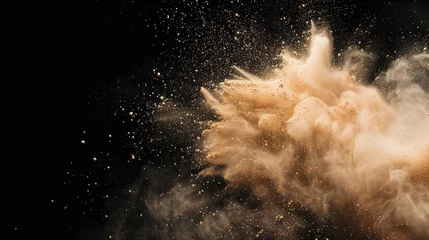 Fotobehang sand particles explosion on black background © fledermausstudio