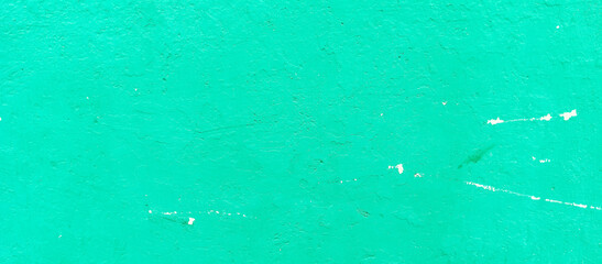The texture of the cement wall faded green paint
