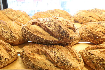 Bread and bakery products lie on display in a store.