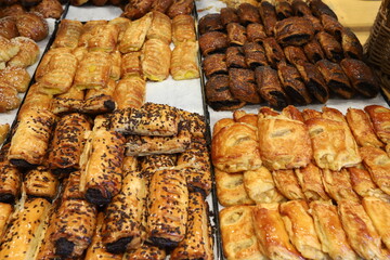Bread and bakery products lie on display in a store.