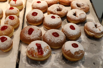 Bread and bakery products lie on display in a store.