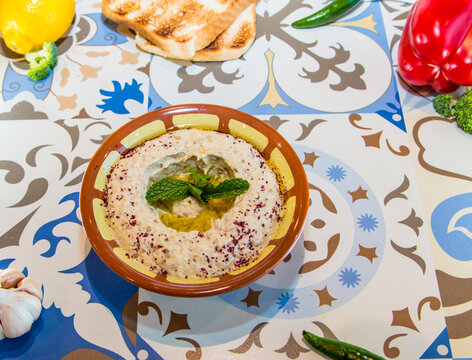 Mutabal or Mutabel with olive oil served in dish isolated on table top view of arabic food