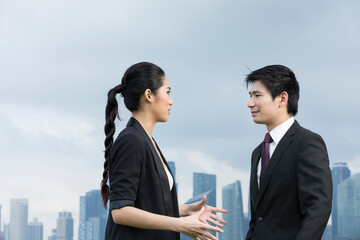 Portrait of asian business people talking outside