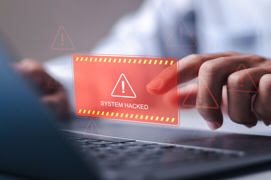 Ransomware malware attack and data breach. Businessman use laptop with virtual screen of system hacked warning sign. spam virus with warning caution for notification on internet security protect.