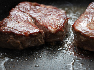 Steak grilled in an iron pan