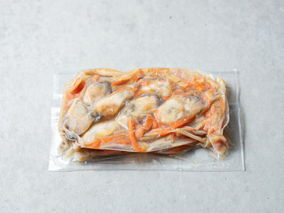 Frozen packaged oysters and stir-fried vegetables