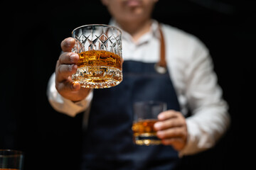 Barman pouring whiskey whiskey glass beautiful night