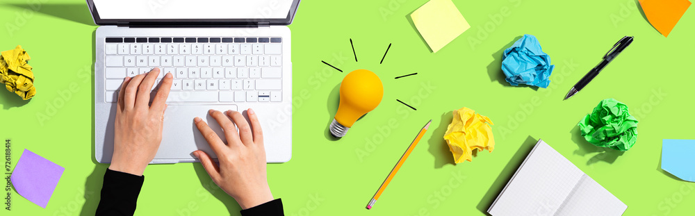 Poster laptop computer with a light bulb from above