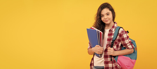 smiling school teen girl ready to study with backpack and notebooks, education. Banner of school girl student. Schoolgirl pupil portrait with copy space.