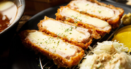 Cheese pork cutlet on a plate