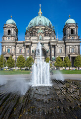 The beautiful Berlin Cathedral with a small fountain