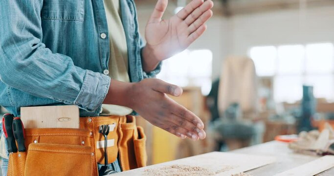 Man, hands and carpenter with dust, powder or finish for production, construction or crafting at workshop. Closeup of male person, builder or woodworker clapping dirt, sawdust or cutting on bench