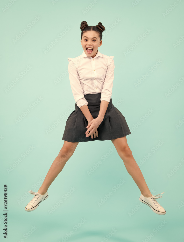 Canvas Prints excited face. full length cheerful teenager kid jump enjoy rejoice win isolated on blue background. 