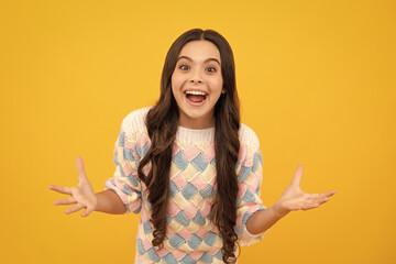 Excited face. Portrait of joyful teen girl with raised hands. Caucasian teenager screaming isolated...